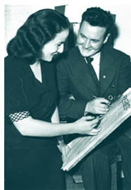 Varsity editor Betsy Mosbaugh looks over a 1944 edition of the paper with assistant editor Bob Grosskurth