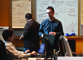 Professor Ron Deibert (centre) has emerged as a leader of a burgeoning global movement that champions free speech and human rights online