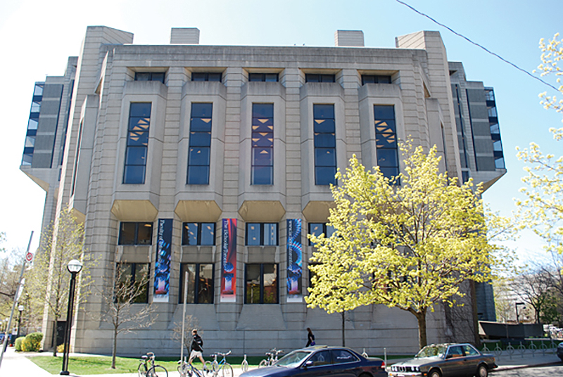 Sunny, external view of Robarts Library from the corner of Sussex Avenue and St. George Street