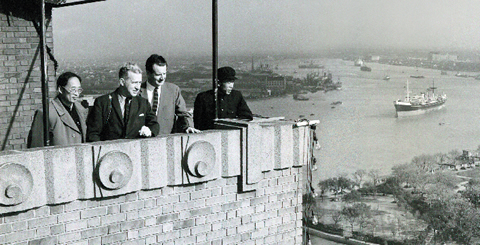 Bissell (third from left) views downtown Shanghai with Geoff Andew, executive assistant to the president of UBC, and thier Chinese hosts. The group spend three days in Shanghai