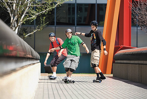 Photo of a group of young people skateboarding.