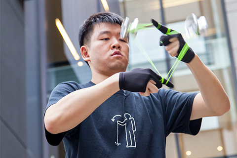 Wayne Ngan forms a triangle using his yo-yo. Photo by Mark Balson