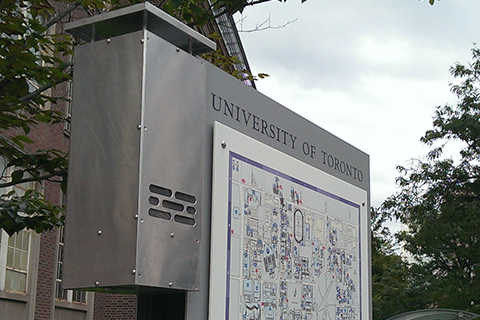 Photo of a UofT infomration kiosk showing a map.