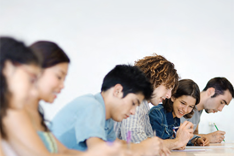 Photo of students writing an exam.