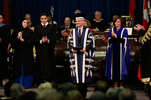 Students Katharine Ball and Mohamed Farid Abdel Hadi, President Meric Gertler, Chair of Governing Council Judy Goldring.