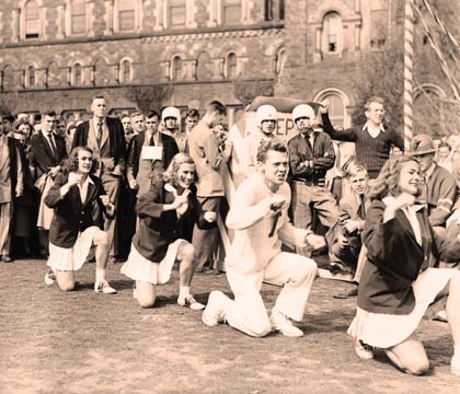 Society cheerleaders dressed in U of T's official colours, blue and white.