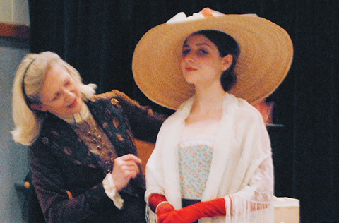 Actor Sharry Flett talks costumes with student Tatiana Haas