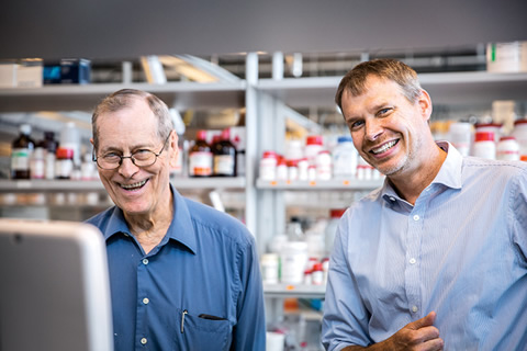 James Till (left) and Peter Zandstra celebrate the announcement of U of T's Medicine by Design initiative .