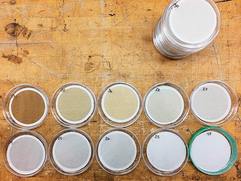 Air filters from different apartments in the same Toronto Community Housing building. Upper left is "almost certainly" from a smoker's unit, says Prof. Jeff Siegel. Lower right never left its case. The one next to it is from a unit where the resident is rarely home. Photo by Eric Li.