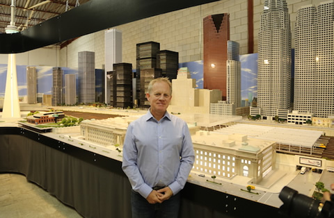 David MacLean stands in front of a model of downtown Toronto