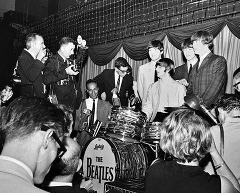 Photo of Robert Morris on stage with the Beatles.