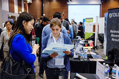 Photo of students with startup supporters.