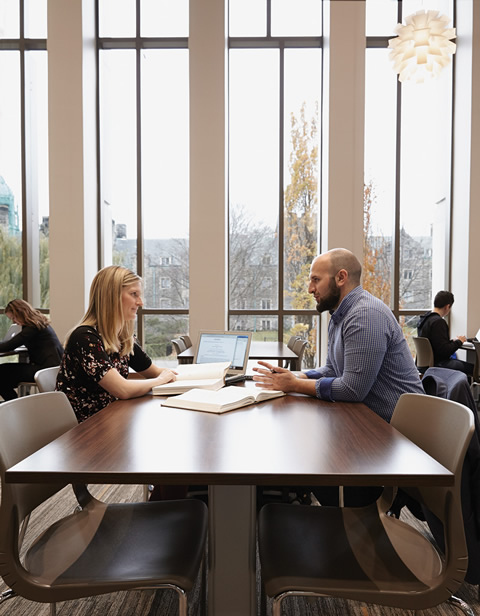 Students Stephanie Lewis and Zachary al-Khatib work together at the Bora Laskin Law Library in the new Jackman Law Building. “Collaboration is essential to every part of the law school process,” says al-Khatib. Photo by Caroline Ryan.