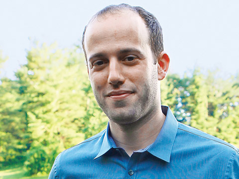 Headshot of Benjamin Joffe-Walt with trees in the background