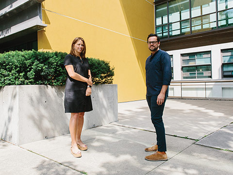 Photo of Prof. Shauna Brail and Prof. Mauricio Quiros-Pacheco standing in front of a building