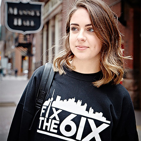 Close up shot of Deanna Lentini wearing a sweater with the words 