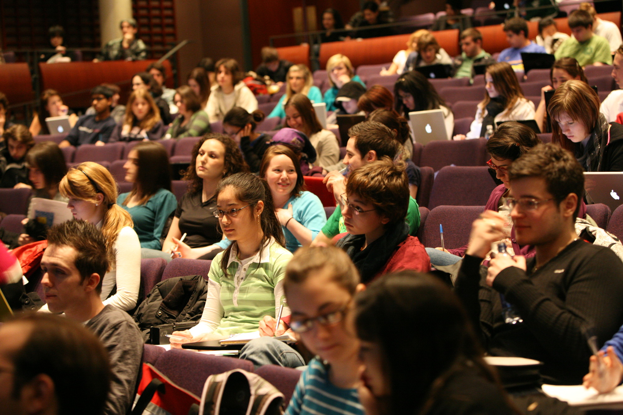 Students socialize before a first year history lecture.