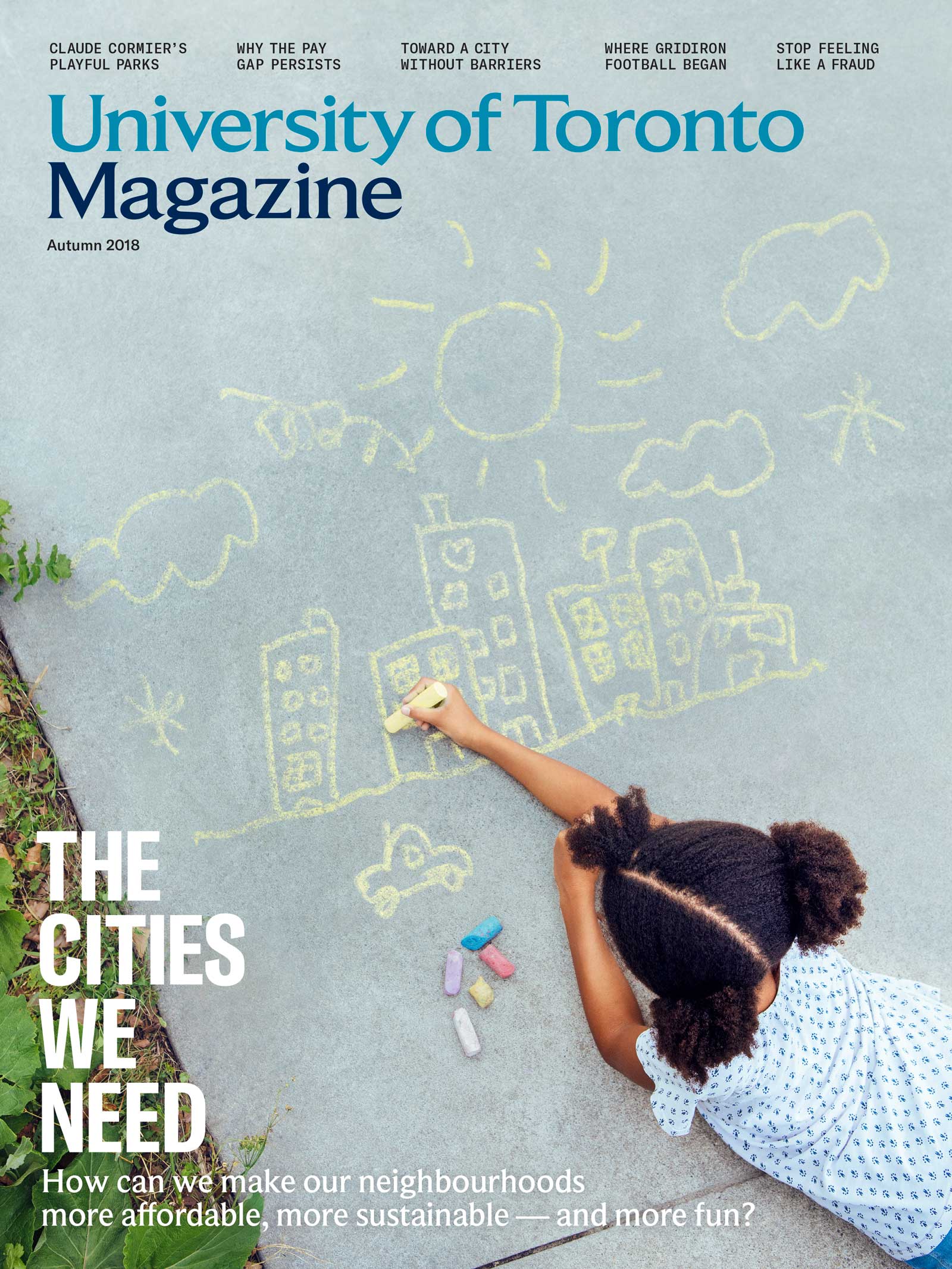 Girl draws a city with sidewalk chalk