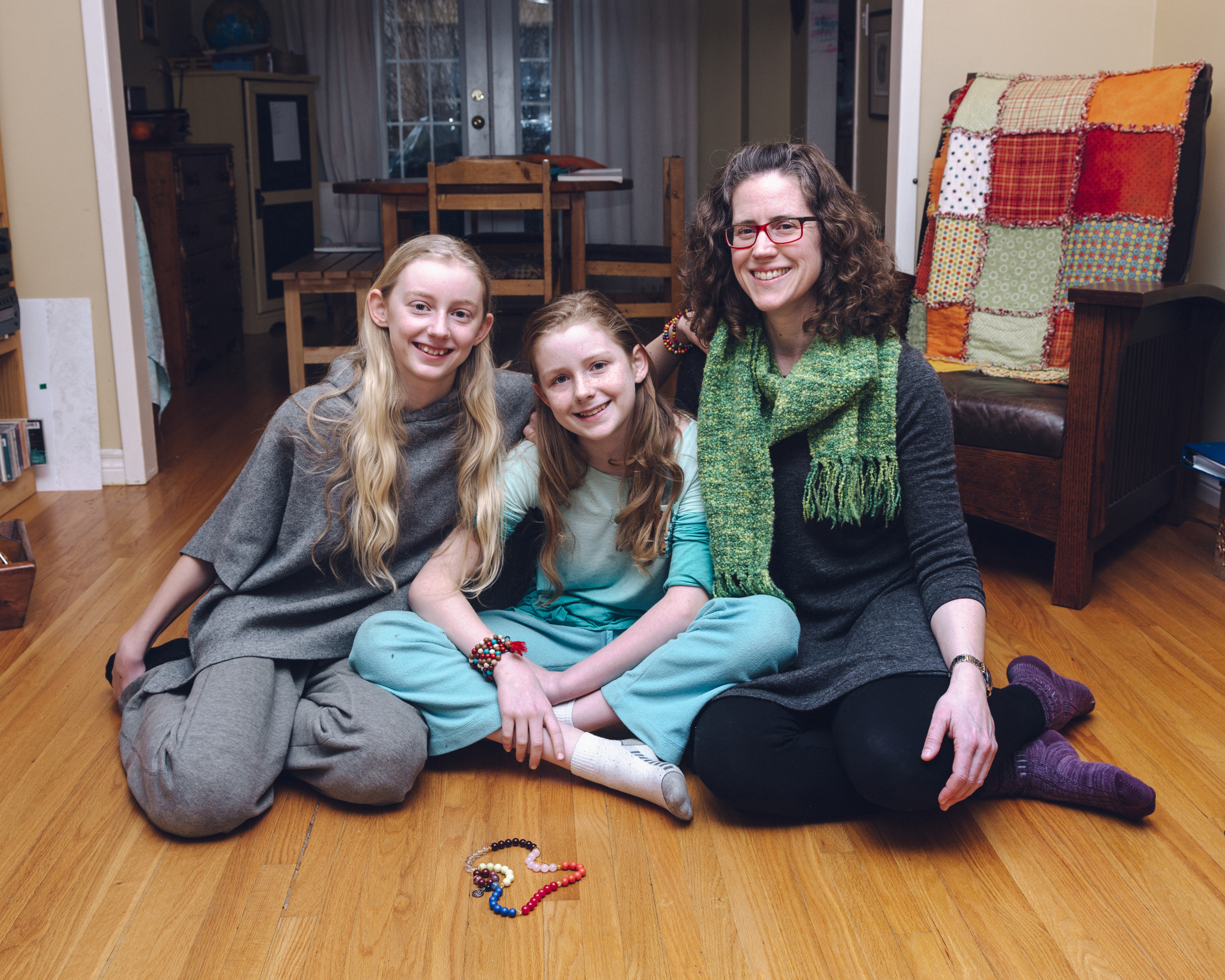 Laura Alary holds a mala as she thinks about the specific things she's grateful for in her life