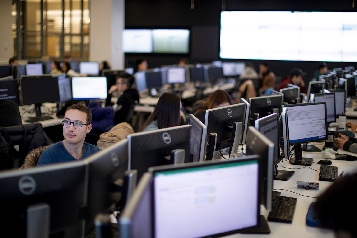 Rows of students working on computers in the BMO Financial Group Finance Research and Trading Lab