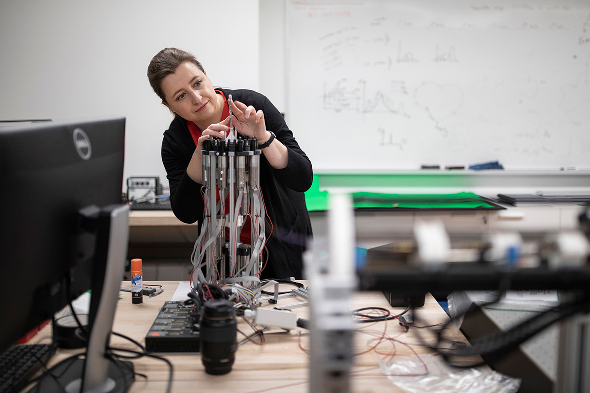 Jessica Burgner Kahrs working on a robot in a lab