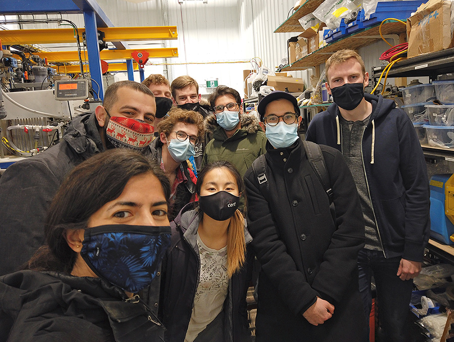 Group photo of nine members of U of T's Carbon XPrize team wearing masks