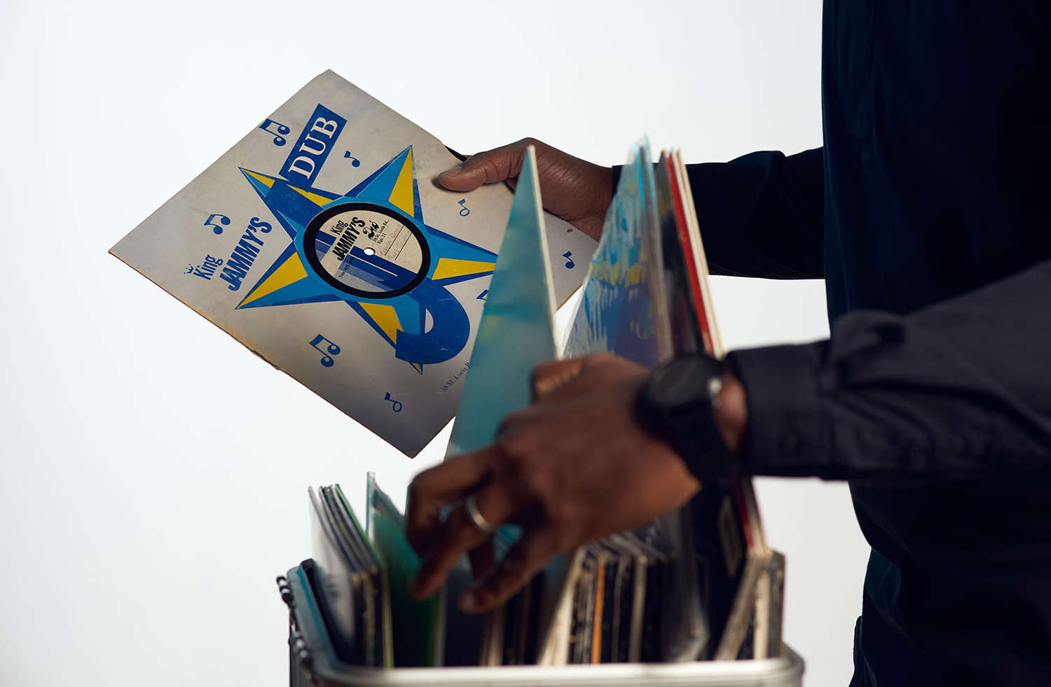 Close up of Prof. Mark V. Campbell's hands taking records from a box