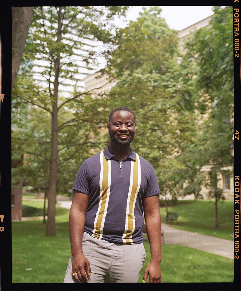 Suddene Stone standing on grass by the Philosopher's Walk path