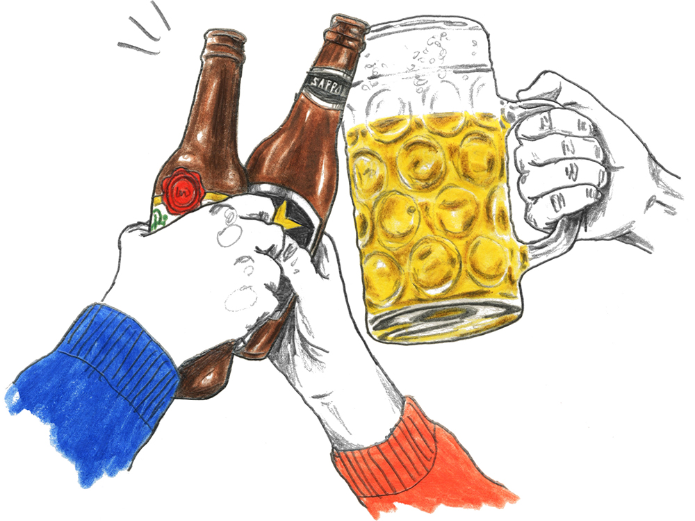 Hands clinking together two bottles of lager beer and a pint glass of beer