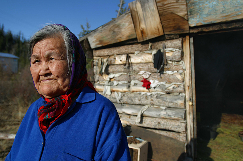 A First Nations female elder wearing a head scarf