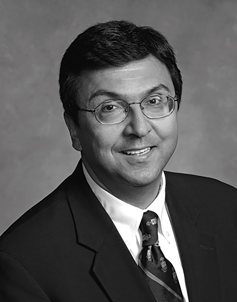 Black and white headshot of David Naylor