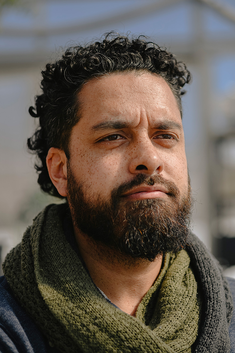 Outdoor headshot of Austin Boyne looking off-camera