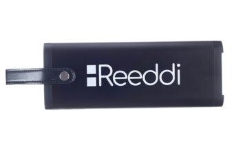 Close up of the Reeddi solar-powered battery, with a black leather handle at one end